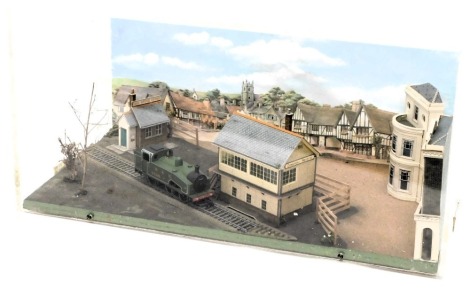 A diorama model of an LNER shunter, with signal box, buildings, etc., in perspex case, 54cm wide.