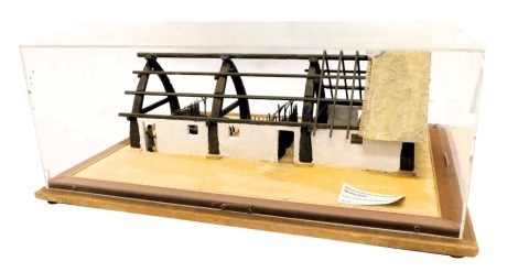 A diorama model of a 15thC peasant's house, in a perspex and wood case, 62cm wide.