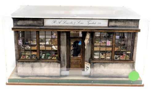 A diorama model of a shop interior, for R&A Lincoln and Sons of Tyndale, containing various miniature cheeses, bread, cooking utensils, etc., 65cm wide.