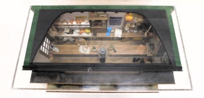 A diorama model of a shop interior, for R&A Lincoln and Sons of Tyndale, containing various miniature cheeses, bread, cooking utensils, etc., 65cm wide. - 2