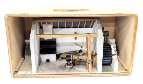 A diorama model of a water mill at blacksmith's shop, in travelling case, 58cm wide.