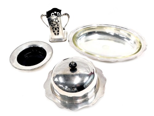 Silver plated wares, comprising Art Nouveau style two handled vase, entree dish, blue glass lined pin dish and butter dish with dome. (4)