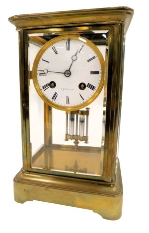 A J. H. Goulding brass cased mantel clock, of rectangular form, with circular enamel Roman numeric border, 30 hour movement, and mercury pendulum on rectangular foot, 24cm high, 15cm wide, and 12cm deep.