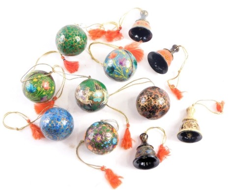 A group of Eastern painted papier mache hanging Christmas decorations, comprising seven round baubles and three bells, each on decorative string.