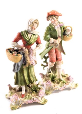 A pair of 19thC Dresden Continental figures, of lady and gentleman carrying flowers and dead wild foul, 22cm high, with blue cross sword mark.