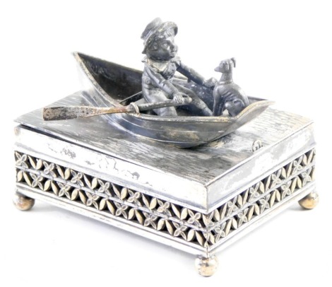 A Simpson Hall Miller & Co quadruple plate silver plated storage box, of rectangular form with raised decoration of rowing boat with figure and dog, pierced decoration on bun feet, 12cm high, 11cm wide, 8cm deep.