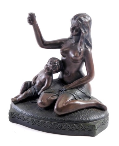 A resin figure group of semi clad female and child, on an oval stepped base, holding up cup, 23cm high, 20cm wide, 10cm deep, marked ARP 641.