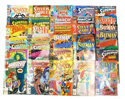 A group of Marvel and DC comics, comprising UK 1986 Classic X Men, 1992 Silver Cable, DC Batman, Super Girl, Robo Cop, Robo Cop 2, Silver Surfers, Batman and others, all circa 1980s and 90s. (a quantity)