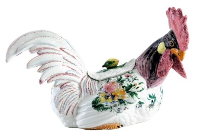 An Italian porcelain egg basket, formed as a cockerel, with green, purple and red detail, 37cm wide, stamped Italia.