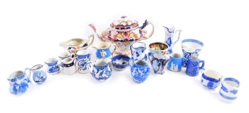 A group of early 20thC ceramics, comprising blue and white cream jugs, Wedgwood cream jug, Gourdy Welsh type teapot, milk jug, sugar bowl, etc. (1 tray, AF)