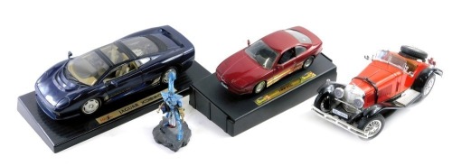 Diecast vehicles, comprising Maisto Jaguar XJ 220 1992, Revell BMW 850i, Bburago Mercedes Benz, and a figure. (4)