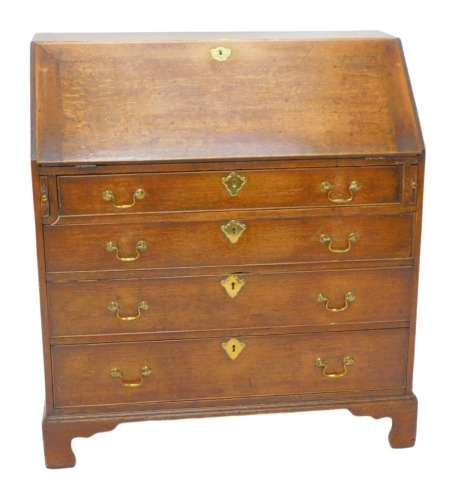 A George III mahogany bureau, the fall enclosing a fitted interior above four graduated drawers, on bracket feet, 97cm wide.