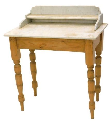 A Victorian pine washstand, with a white marble top on turned legs, 80cm wide.