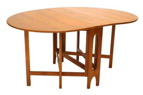 A G-Plan teak drop leaf table, on pierced end supports, 107cm wide.