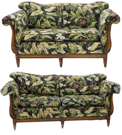 A continental mahogany three seater sofa, upholstered with fabric decorated with exotic flowers and leaves, with show frame scrolling arm supports, frieze and square tapering fluted legs, 200cm wide, and a matching two seater sofa, 166cm wide. (2)