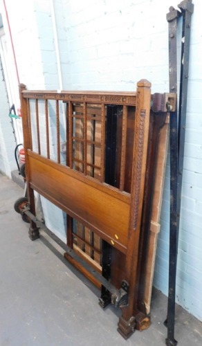 An oak double bed frame, inscribed RW.