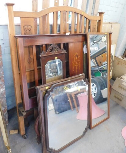 A group of Edwardian and other bed frames, one with boxwood inlay and various wall mirrors. (a quantity)