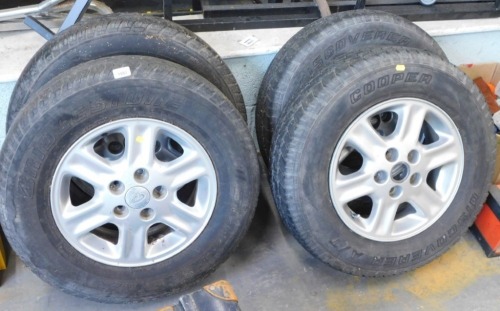 A set of four Landrover alloys and Bridgestone H/T tyres.