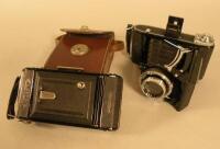 Two Zeiss Ikon bellows cameras.