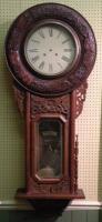 A 19thC carved mahogany drop dial wall clock