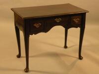 An oak and mahogany crossbanded lowboy in mid 18thC style