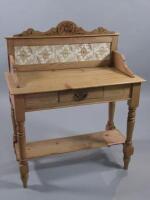 A Victorian pine washstand with a tile back