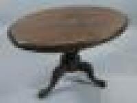 A Victorian walnut and marquetry oval breakfast table on tripod base