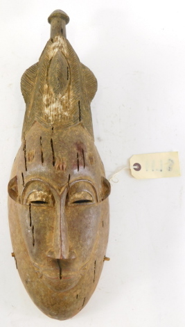 An Old Mblo portrait mask with encrusted patina, Cote D'Ivoire, 50cm high. (AF)