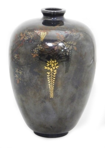 A Meiji period Nogawa shibuichi vase, of shouldered, tapering form decorated in silver, copper and gold inlay with trailing wisteria, inlaid Nogawa studio mark to base, 12cm high.