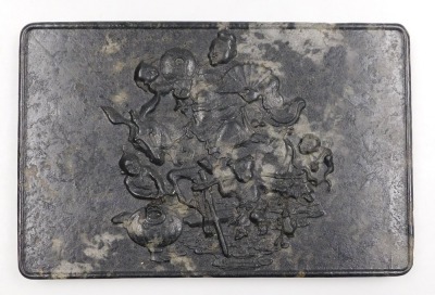 A 19thC Qing dynasty Chinese mottled black jade panel, possibly for a table screen, of rectangular section, decorated in relief with the Immortal Han Zhonglu, riding a donkey, and accompanied by four boys serving wine, 16cm high, 24.5m wide. - 2