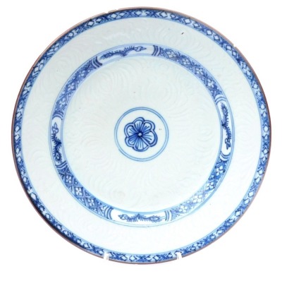 An 18thC Qing dynasty blue and white plate, an hua decorated with stylised flowers, within hatched borders, 22.5cm wide.