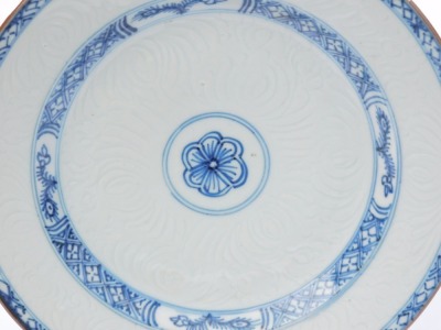 An 18thC Qing dynasty blue and white plate, an hua decorated with stylised flowers, within hatched borders, 22.5cm wide. - 2