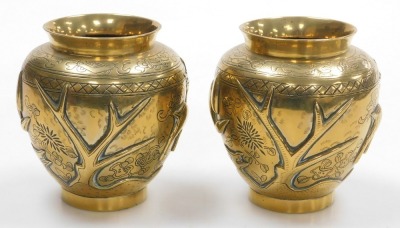 A pair of early 20thC Chinese heavy brass vases, embossed with a deer, bamboo, trees and a crane, the bases with seal script marks on wooden stands, 19.5cm high. - 3