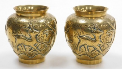 A pair of early 20thC Chinese heavy brass vases, embossed with a deer, bamboo, trees and a crane, the bases with seal script marks on wooden stands, 19.5cm high. - 4