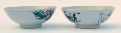 Two 20thC Chinese famille rose porcelain bowls, one painted with flowers, internally with fruit, printed seal mark, 15.5cm wide, the other with a garden, internally with fruit, 15.5cm wide, (2) - 5