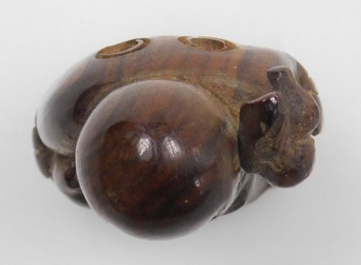 A contemporary Japanese style hardwood netsuke of Fukurokuju, modelled standing holding a peach in one hand, a staff in the other, 5cm high. - 5