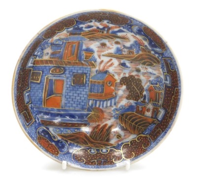 A Qianlong famille rose porcelain tankard, with a dragon handle, painted with reserves of figures in a garden, birds and flowers, within a blue floral ground, 11cm high, together with an early 19thC blue and white, and clobbered chinoiserie saucer, 14cm w - 2