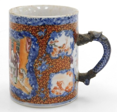 A Qianlong famille rose porcelain tankard, with a dragon handle, painted with reserves of figures in a garden, birds and flowers, within a blue floral ground, 11cm high, together with an early 19thC blue and white, and clobbered chinoiserie saucer, 14cm w - 5