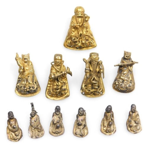 A group of early 20thC Chinese brass figures of deities, 2cm and 3cm high respectively. (10)