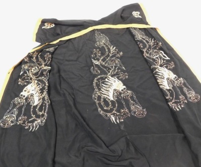 An early 20thC Chinese black silk short surcoat, embroidered with dragons in pink and white, with peach trim. - 4