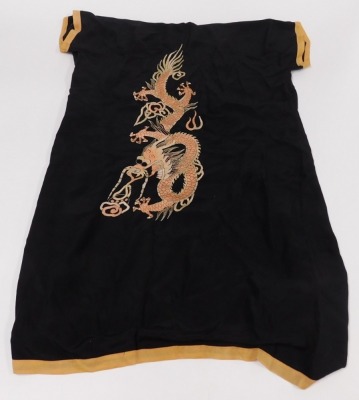 An early 20thC Chinese black silk short surcoat, embroidered with dragons in pink and white, with peach trim. - 5