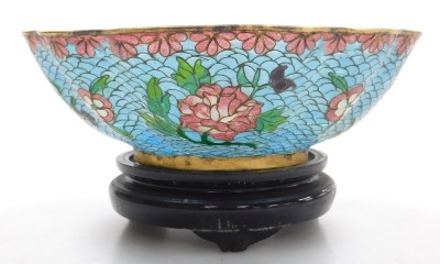 A 20thC Chinese plique-a-jour enamel bowl, of fluted form, decorated with flowers on a turquoise ground, with hardwood stand, boxed, 15cm wide, together with a cloisonne box and cover, of cylindrical form, decorated with flowers on a blue ground, boxed, 9 - 4