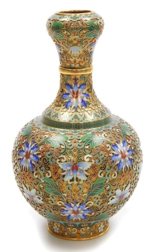 A 20thC Chinese champleve enamel vase, of bottle neck form, decorated with lotus flowers and scrolling leaves, 23cm high.