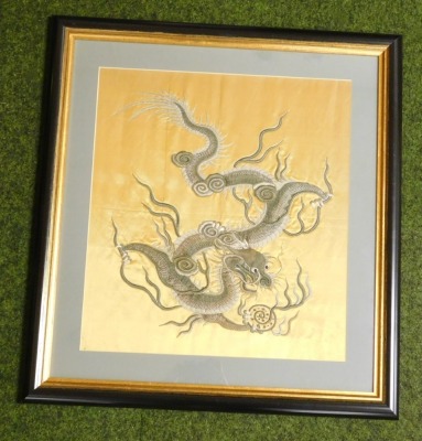 A late 19thC Chinese stump work embroidery, on gold silk, of a four claw dragon, in white and silver silk, holding a flaming pearl, 46cm high, 41cm wide. - 2