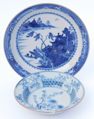 A group of Qing dynasty blue and white porcelain, 18thC and later, comprising a dish decorated with a river landscape, two plates decorated with flowers, and a dish decorated with flowers. (4, AF) - 7