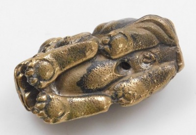 A 20thC Chinese bronze figure of a lion dog, modelled in recumbent pose, 5cm long. - 5