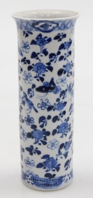 A garniture of Kangxi style porcelain blue and white vases, decorated with birds, flowers and butterflies, comprising a pair of baluster vases and covers, 22cm high, and a sleeve vase, four character Kangxi marks, 19th century, 20.5cm high. (3, AF) - 2