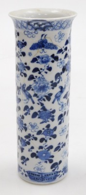 A garniture of Kangxi style porcelain blue and white vases, decorated with birds, flowers and butterflies, comprising a pair of baluster vases and covers, 22cm high, and a sleeve vase, four character Kangxi marks, 19th century, 20.5cm high. (3, AF) - 3