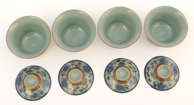 A modern Chinese pottery part tea service, decorated in blue and white with peonies against a pale blue ground, comprising a covered jug, four tea bowls, covers and saucers, and four smaller bowls, together with a metal tea strainer. - 6