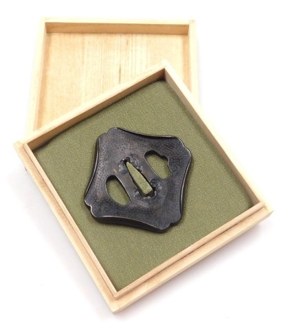 A bronze Wakizashi tsuba, possibly pre 1600, of rhomboid form, with shakudo patina, 7cm wide.